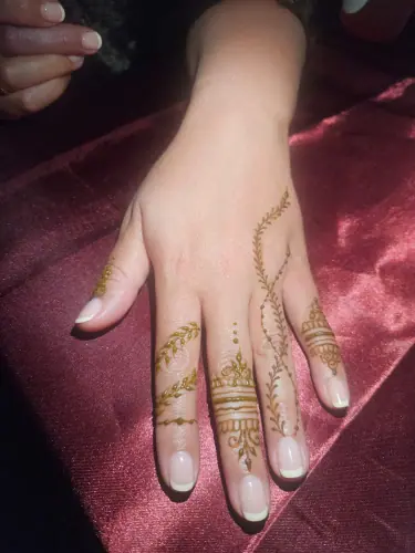 Delicate henna finger bands joined by fine dotted chains